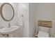 Clean powder room featuring a pedestal sink, modern fixtures, and decor creating a functional and inviting space at 3541 Wilton Ave, Atlanta, GA 30340