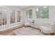 Bright sunroom with natural light, french doors, and a comfortable seating area at 3541 Wilton Ave, Atlanta, GA 30340
