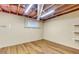 Unfinished basement space with open ceiling, concrete walls and wood laminate flooring at 514 Macedonia Forest Circle Cir, Canton, GA 30115