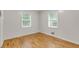 Well-lit bedroom with hardwood floors, neutral walls, and windows at 514 Macedonia Forest Circle Cir, Canton, GA 30115