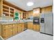 Bright kitchen features wood cabinets and stainless steel appliances; adjoining a spacious living area at 514 Macedonia Forest Circle Cir, Canton, GA 30115
