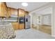 Well-lit kitchen with granite counters and stainless steel appliances, adjoining a spacious living area at 514 Macedonia Forest Circle Cir, Canton, GA 30115