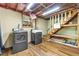 Basement laundry room with washer, dryer, small window, and stairway at 514 Macedonia Forest Circle Cir, Canton, GA 30115