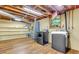 Basement laundry room with shelving, washer, dryer and wood laminate flooring at 514 Macedonia Forest Circle Cir, Canton, GA 30115