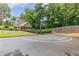 Community basketball court surrounded by lush greenery and mature trees at 2905 Ivey Ridge Ln, Roswell, GA 30076