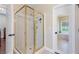 Shower featuring tile surround and glass doors at 2905 Ivey Ridge Ln, Roswell, GA 30076