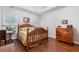 Cozy bedroom features hardwood floors and ample natural light at 2905 Ivey Ridge Ln, Roswell, GA 30076