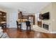 Open concept kitchen with breakfast bar and a cozy fireplace with TV at 2905 Ivey Ridge Ln, Roswell, GA 30076
