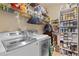 Spacious laundry room with washer, dryer and ample storage at 2905 Ivey Ridge Ln, Roswell, GA 30076