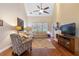 Cozy living room with vaulted ceilings, hardwood floors, and a fireplace at 2905 Ivey Ridge Ln, Roswell, GA 30076