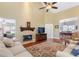 Open-concept living area with a fireplace, hardwood floors, and plenty of natural light at 2905 Ivey Ridge Ln, Roswell, GA 30076