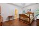 Comfortable main bedroom with hardwood floors, great natural light and ensuite bathroom at 2905 Ivey Ridge Ln, Roswell, GA 30076