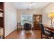 Bright home office featuring hardwood floors, built-in shelves, and ample natural light perfect for remote work at 2905 Ivey Ridge Ln, Roswell, GA 30076
