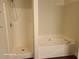 Bathroom featuring separate shower and tub at 303 Tara Commons Cir, Loganville, GA 30052