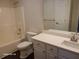 Bathroom features white cabinets, granite counters and shower/tub at 303 Tara Commons Cir, Loganville, GA 30052