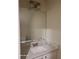 Bathroom featuring a vanity with a wide mirror, white marble countertops and white cabinetry below at 303 Tara Commons Cir, Loganville, GA 30052
