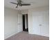 Bedroom with ceiling fan and double door closet at 303 Tara Commons Cir, Loganville, GA 30052