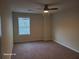 Bedroom features window and ceiling fan at 303 Tara Commons Cir, Loganville, GA 30052