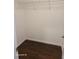 Walk-in closet includes shelving and hardwood floor at 303 Tara Commons Cir, Loganville, GA 30052