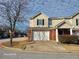 Charming two-story townhome featuring a brick facade and an attached single-car garage at 303 Tara Commons Cir, Loganville, GA 30052