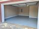 Spacious garage with epoxy flooring and ample room for storage, ready for vehicles and projects at 303 Tara Commons Cir, Loganville, GA 30052
