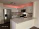 Modern kitchen featuring stainless steel appliances, granite countertops and stylish lighting fixtures at 303 Tara Commons Cir, Loganville, GA 30052