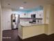 Modern kitchen featuring white cabinets, stainless steel appliances, and granite countertops at 303 Tara Commons Cir, Loganville, GA 30052