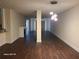 Spacious living room with dark wood floors, fireplace, and modern lighting at 303 Tara Commons Cir, Loganville, GA 30052