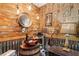 Unique bathroom design with stylish wallpaper, rustic sink, and a modern touch at 3861 Riding Sw Trl, Powder Springs, GA 30127