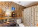 Quirky bathroom featuring vintage decor, an antique telephone, and rustic fixtures at 3861 Riding Sw Trl, Powder Springs, GA 30127