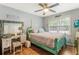 Comfortable bedroom featuring ample natural light from the large windows at 3861 Riding Sw Trl, Powder Springs, GA 30127