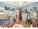 Cozy bedroom with vintage furniture, ample natural light, and convenient access to other rooms at 3861 Riding Sw Trl, Powder Springs, GA 30127