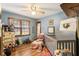 Cozy bedroom filled with vintage accents and ample natural light at 3861 Riding Sw Trl, Powder Springs, GA 30127