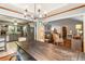 Stylish dining room with a large table that connects to kitchen and living room at 3861 Riding Sw Trl, Powder Springs, GA 30127