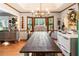 Large dining room featuring hardwood floors and views from the window at 3861 Riding Sw Trl, Powder Springs, GA 30127