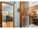 The hallway connects multiple rooms with natural wood accents and a view into the living area at 3861 Riding Sw Trl, Powder Springs, GA 30127