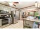Modern kitchen with stainless steel appliances, granite counters, and an island at 3861 Riding Sw Trl, Powder Springs, GA 30127