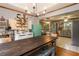Charming kitchen features a farmhouse table and chairs with stainless steel appliances and a vintage refrigerator at 3861 Riding Sw Trl, Powder Springs, GA 30127