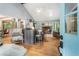Open living room featuring hardwood floors, vaulted ceiling, fireplace and stylish furnishings at 3861 Riding Sw Trl, Powder Springs, GA 30127