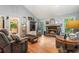 Open living room with fireplace and hardwood floors, great for entertaining at 3861 Riding Sw Trl, Powder Springs, GA 30127