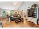 Bright living room featuring hardwood floors and lots of natural light at 3861 Riding Sw Trl, Powder Springs, GA 30127
