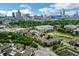 Aerial view showcasing apartments, a golf course, and the Atlanta skyline at 400 17Th Nw St # 2412, Atlanta, GA 30363