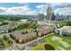 Picturesque aerial view of property near lush green space, pond, and stunning skyline at 400 17Th Nw St # 2412, Atlanta, GA 30363