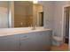 Bathroom featuring double sinks, a large mirror, and modern cabinetry at 400 17Th Nw St # 2412, Atlanta, GA 30363