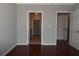 Bedroom features hardwood floors, a ceiling fan, and access to the bathroom and closet at 400 17Th Nw St # 2412, Atlanta, GA 30363