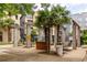 Charming courtyard with palm trees, barbecue area, and comfortable seating at 400 17Th Nw St # 2412, Atlanta, GA 30363