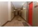 Condo hallway with tiled flooring and a red door for unit 2412 at 400 17Th Nw St # 2412, Atlanta, GA 30363