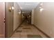 Well-lit hallway with neutral tones and tiled floors leading to unit 2412 at 400 17Th Nw St # 2412, Atlanta, GA 30363