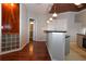 Open-concept kitchen and dining area with dark hardwood floors and modern pendant lighting at 400 17Th Nw St # 2412, Atlanta, GA 30363