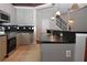 Kitchen with stainless steel appliances, tiled backsplash, and a breakfast bar at 400 17Th Nw St # 2412, Atlanta, GA 30363
